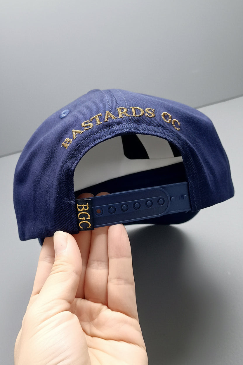 Rear view of The Major golf cap with embroidered Bastards GC branding and close up of BGC rear tab