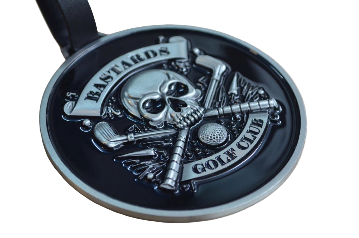 Golf ball marker with skull design and 'Bastards Golf Club' text on a black background