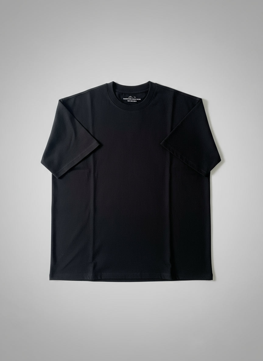 Black t-shirt with a brand logo on a textured surface
