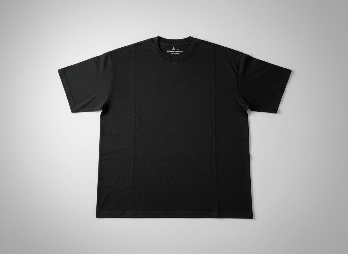 Black t-shirt on a plain grey background