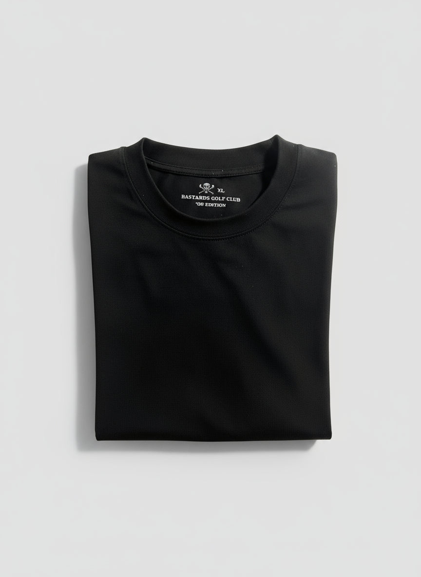 Close-up of a black shirt with a brand label on a grey background