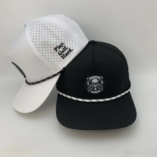 Two baseball caps, one white and one black, on a light gray background.