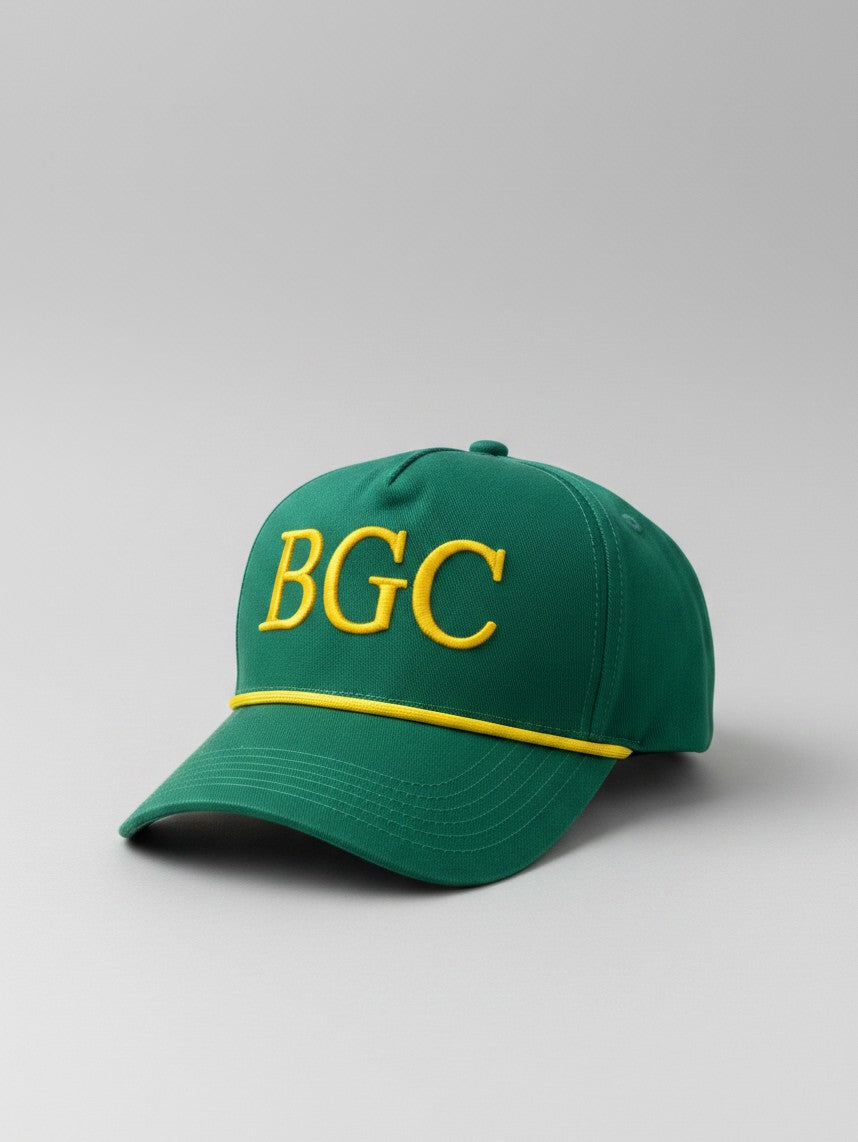 Three-quarter front view of Sunday Green golf cap showing gold BGC embroidery and braided rope