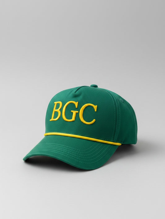 Three-quarter front view of Sunday Green golf cap showing gold BGC embroidery and braided rope