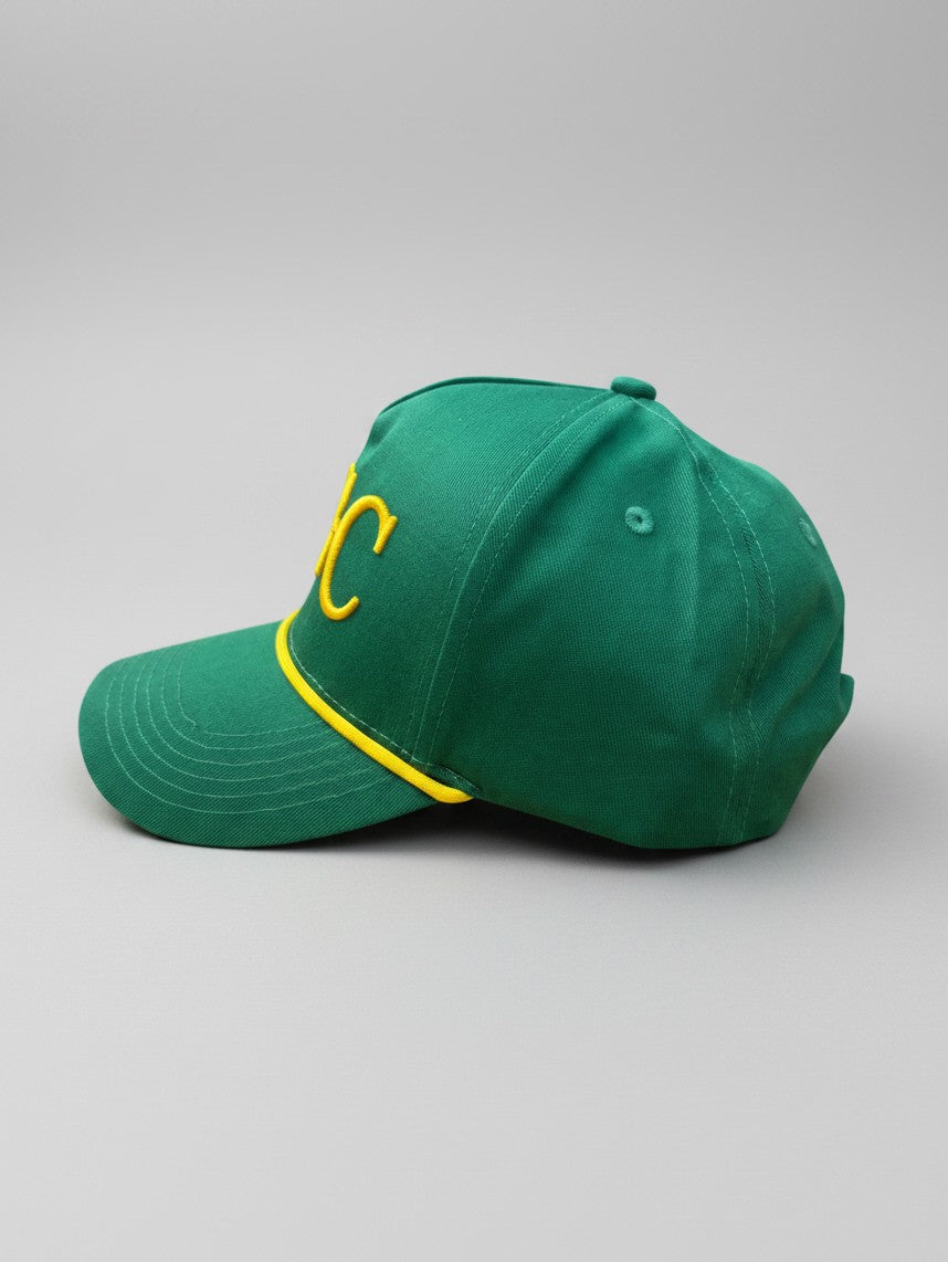 Left side profile of Sunday Green structured green and gold golf rope cap