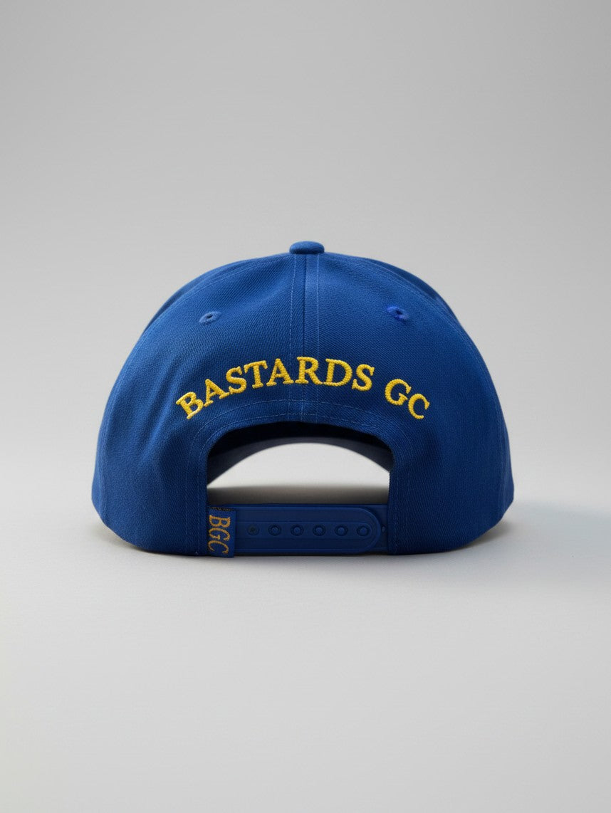 Rear view of The Captain blue golf cap with gold Bastards GC embroidery and BGC rear tab