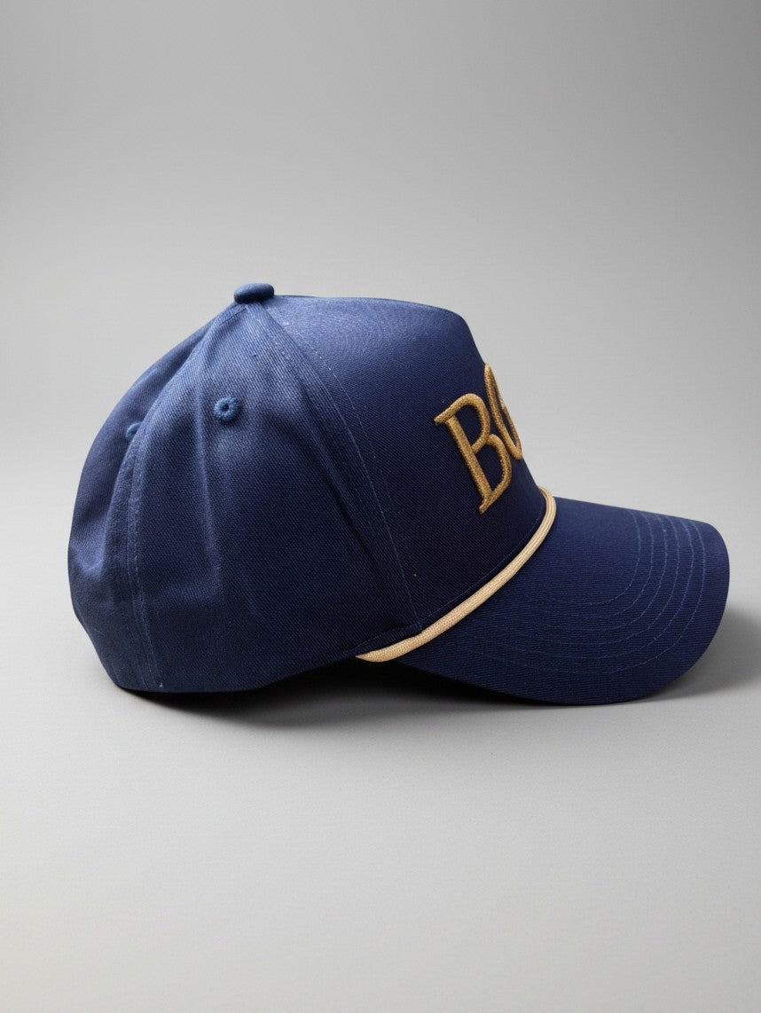 Right side profile of The Major navy and gold structured golf rope cap
