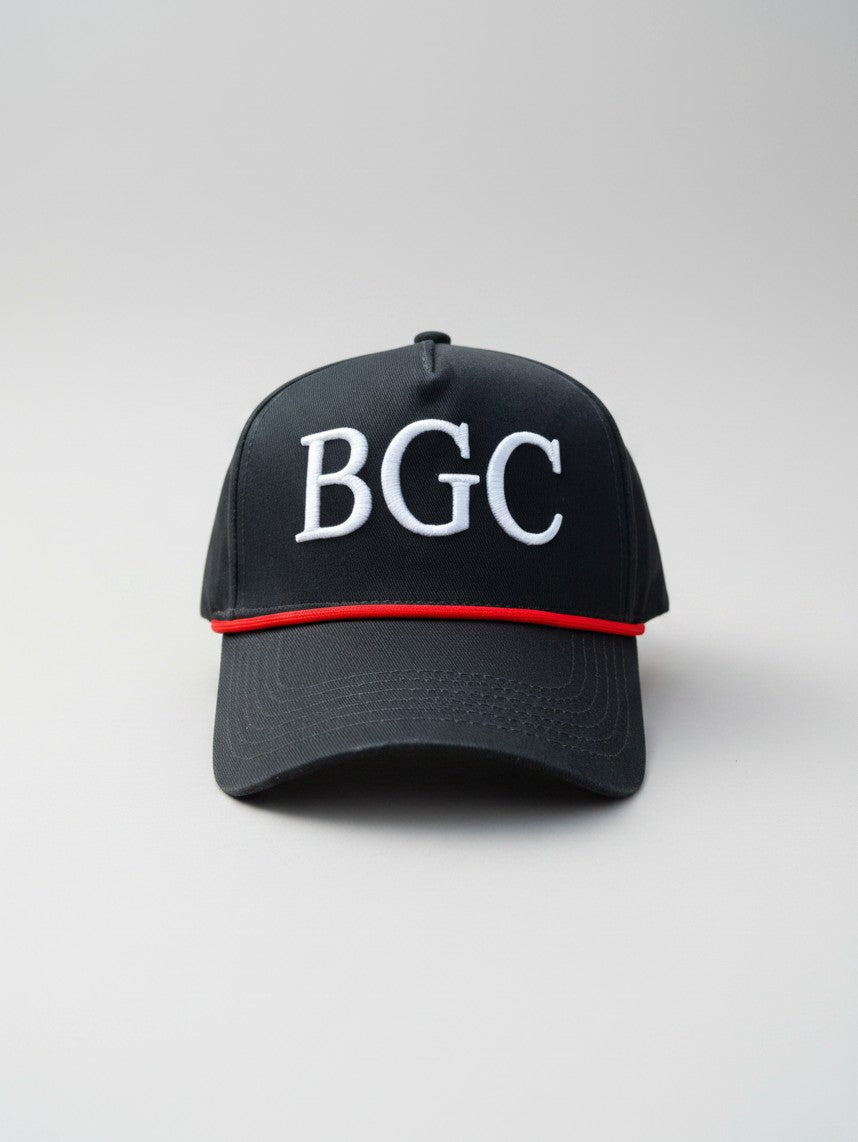 Front view of The Yank navy golf rope cap with raised white BGC embroidery and red braided rope